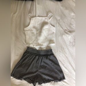 Blue high neck cropped tank with blue and white stripped flowy shorts